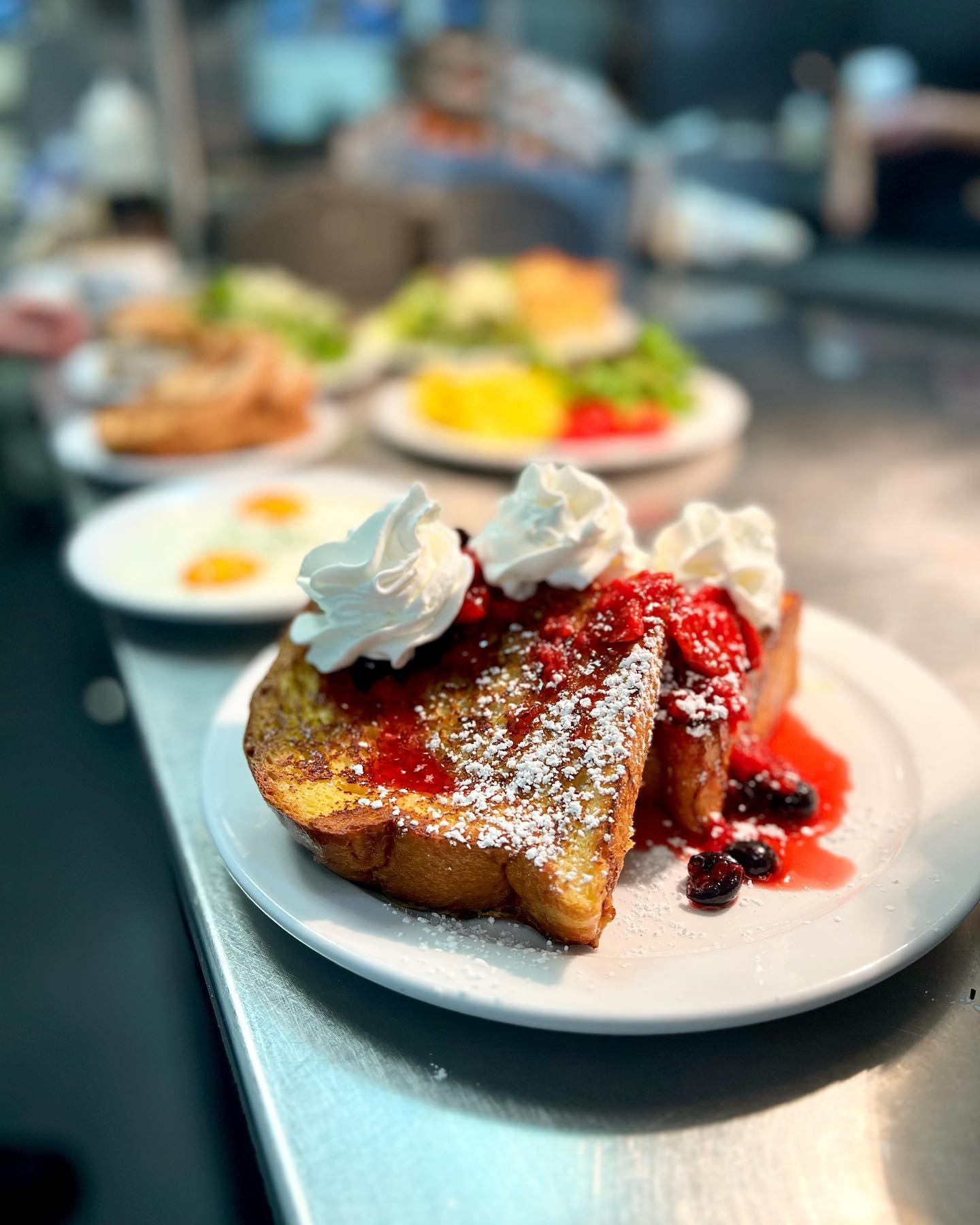 French Toast with choice of Honey butter + Curry Farms syrup Macerated berries + whipped cream Espresso créme anglaise + vanilla mascarpone
